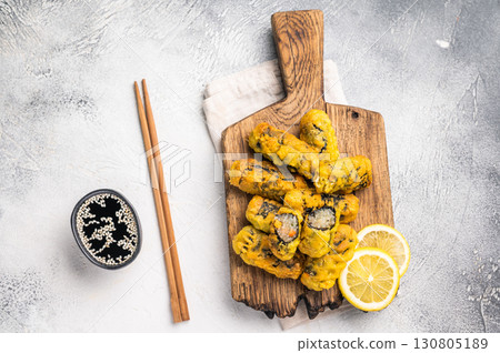 Gimmari, korean deep fried snack, seawed rolls and noodles glass. grey background. top view Gimmari, korean deep fried snack, seawed rolls and noodles glass. grey background. top view 130805189