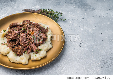 Homemade French Beef Bourguignon Stew on a plate with mashed potatoes. grey background. top view 130805199