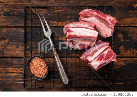 Thick Cut raw lamb Short Ribs, fresh mutton meat with bone. wooden background. top view 130805202