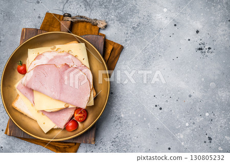 Ham and cheese sandwich, toast with sliced Prosciutto Cotto. grey background. top view Ham and cheese sandwich, toast with sliced Prosciutto Cotto. grey background. top view 130805232