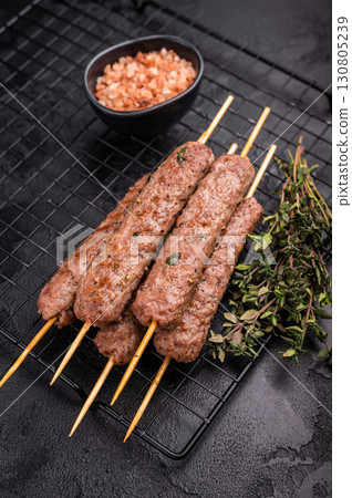 Grilled Cevapcici skewers, Cevapi sausages from mince beef and pork meat. black background. top view 130805239