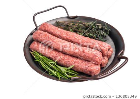 Raw Cevapcici ready for the grill, fresh Cevapi from mince beef meat isolated on white background. top view Raw Cevapcici ready for the grill, fresh Cevapi from mince beef meat isolated on white background. top view 130805349
