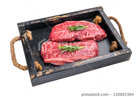 Raw Top blade steak, shoulder beef meat in wooden tray isolated on white background. top view 130805364