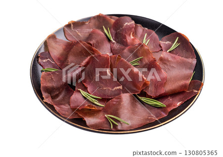 Spanish tapa Cecina meat slices, beef jamon on plate with herbs isolated on white background. top view Spanish tapa Cecina meat slices, beef jamon on plate with herbs isolated on white background. top view 130805365
