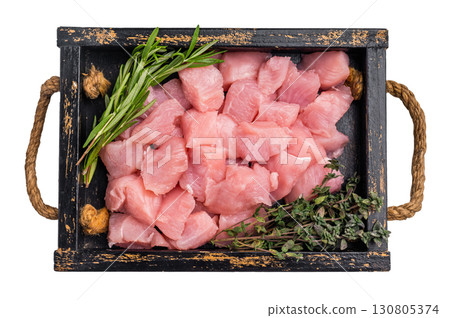 Diced sliced turkey fillet cubes, poultry meat with herbs for cooking isolated on white background. top view 130805374