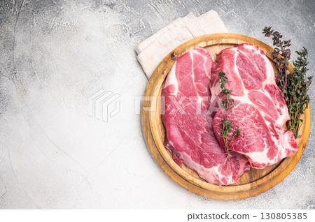 Raw pork tender neck steak, fresh meat. grey background. top view 130805385