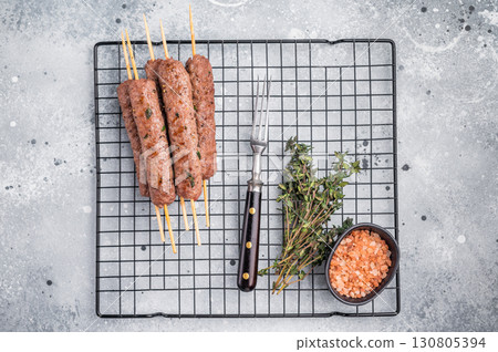 BBQ Roasted beef and lamb meat kebabs sausages, kofta kebab. grey background. top view 130805394