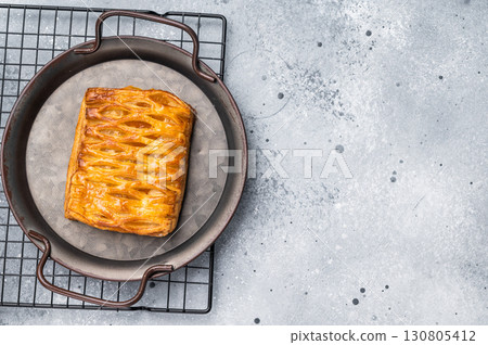 Danish pastry with a lemon jam, Puff pastry. grey background. top view Danish pastry with a lemon jam, Puff pastry. grey background. top view 130805412