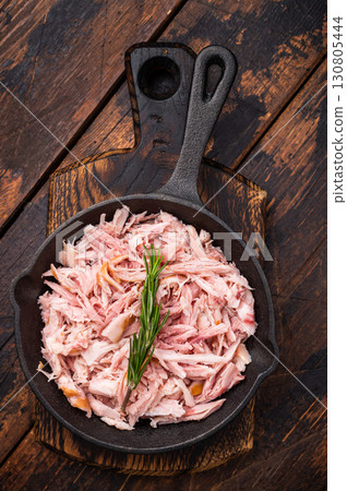 BBQ smoked Pulled Chicken meat in a skillet. wooden background. top view BBQ smoked Pulled Chicken meat in a skillet. wooden background. top view 130805444