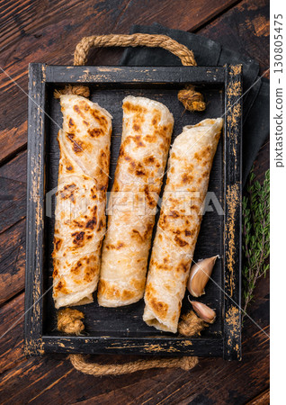 Aloo Paratha rolls, Indian Flatbread. wooden background. top view 130805475