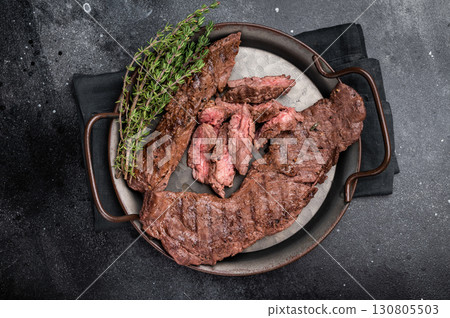 Grilled Beef Machete Skirt Steak, prime meat. black background. top view 130805503