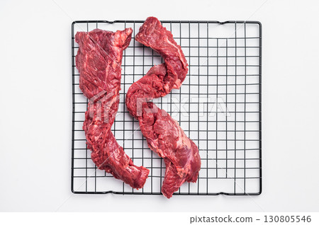 Raw Beef Skirt Steak, Machete steak, uncooked meat isolated on white background Raw Beef Skirt Steak, Machete steak, uncooked meat isolated on white background 130805546