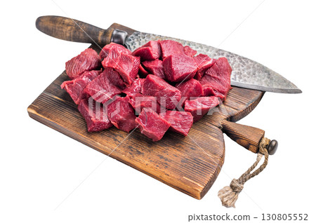 Diced Raw Venison meat, fresh Wild Roe Deer Game Meat on butcher cutting board Isolated on white background. top view Diced Raw Venison meat, fresh Wild Roe Deer Game Meat on butcher cutting board Isolated on white background. top view 130805552