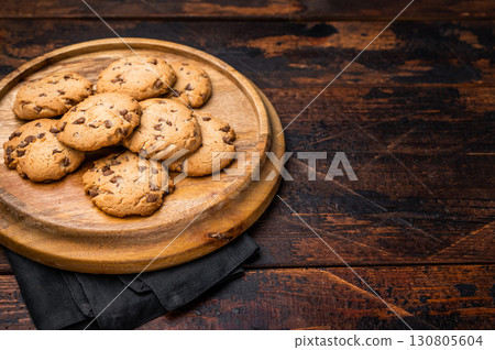 Chocolate chip cookies on wooden board. wooden background. top view Chocolate chip cookies on wooden board. wooden background. top view 130805604