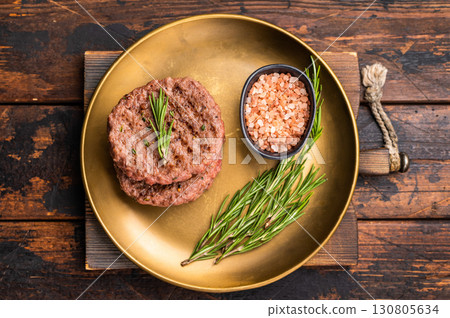 BBQ roasted hamburger chopped meat steaks patties with rosemary. wooden background. top view 130805634