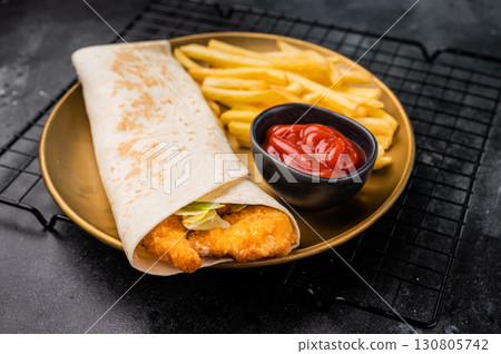 Doner kebab with shrimps, prawns, salad and french fry. black background. top view 130805742