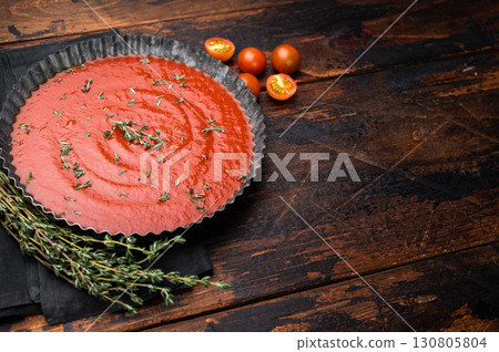 Tomato paste sauce with thyme in plate, canned food for cookng. wooden background. top view Tomato paste sauce with thyme in plate, canned food for cookng. wooden background. top view 130805804