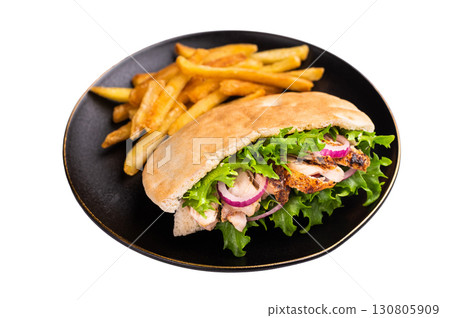 Turkish Shawarma, Doner kebab with grilled chicken meat in pita bread isolated on white background Turkish Shawarma, Doner kebab with grilled chicken meat in pita bread isolated on white background 130805909