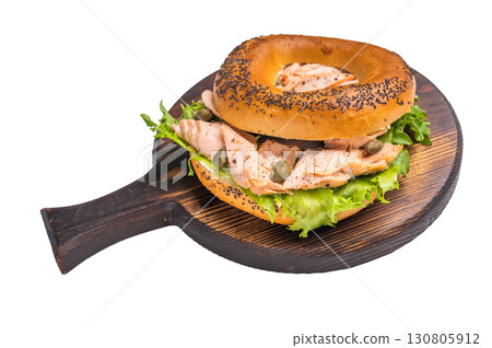 Homemade Bagel with lox, smoked salmon and cream cheese on wooden board isolated on white background Homemade Bagel with lox, smoked salmon and cream cheese on wooden board isolated on white background 130805912