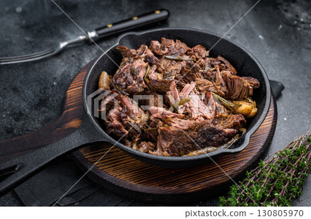 Beef bourguignon stew with tender beef in a pan. black background. top view 130805970
