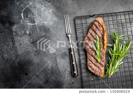 Grilled Brazilian picanha, rump cap beef steak. black background. top view 130806029