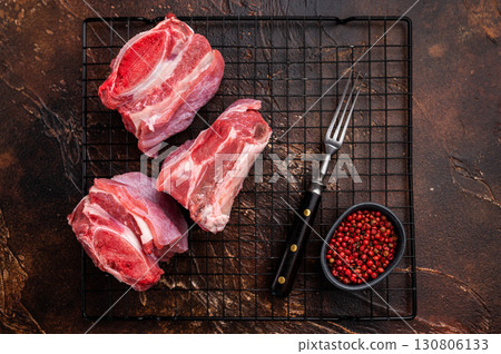 Thick Cut raw Beef Short Ribs, fresh meat with bone. brown background. top view 130806133