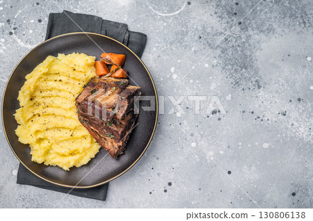 Slow cooked Beef short ribs, perfectly cooked and glazed with a rich barbecue sauce. grey background. top view 130806138