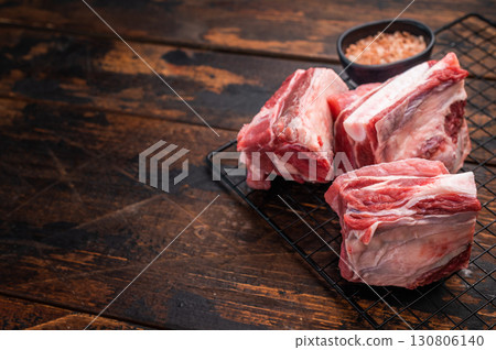 Thick Cut raw lamb Short Ribs, fresh mutton meat with bone. wooden background. top view 130806140