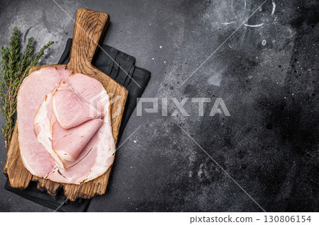 Sliced pork ham for sandwiches, smoked meat. black background. top view Sliced pork ham for sandwiches, smoked meat. black background. top view 130806154