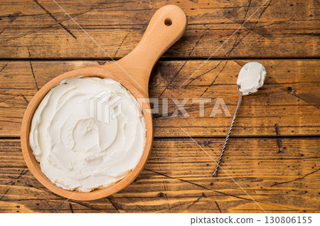 Italian Mascarpone cheese, cream cheese for tiramisu. wooden background. top view Italian Mascarpone cheese, cream cheese for tiramisu. wooden background. top view 130806155