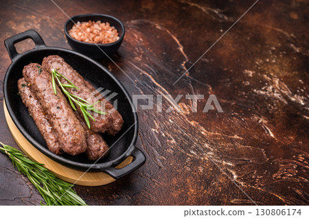 BBQ roast Turkish Urfa kebab with herbs. brown background. top view BBQ roast Turkish Urfa kebab with herbs. brown background. top view 130806174