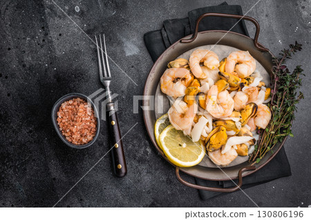 Fresh Seafood Mix with Mussels, Clams, Prawns, Shrimps and squid. black background. top view 130806196