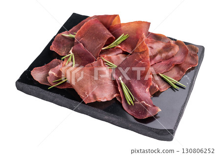 Cured cecina meat slices, spanish meat jerky isolated on white background. top view Cured cecina meat slices, spanish meat jerky isolated on white background. top view 130806252