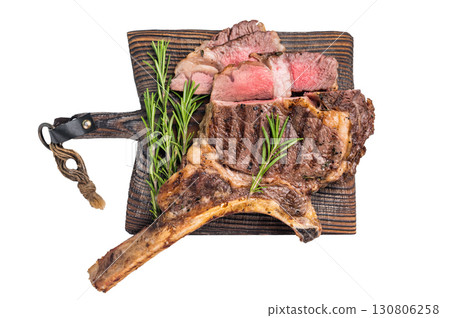 BBQ fried Tomahawk beef steak, grilled marbled rib eye with bone on wooden board isolated on white background. top view 130806258