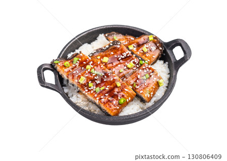 Japanese Cuisine Unadon, grilled unagi eel with rice in a skillet isolated on white background. top view 130806409