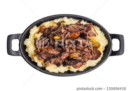 Braised Beef Cheek, Slow cooked meat with smashed potatoes in a skillet isolated on white background. top view 130806438