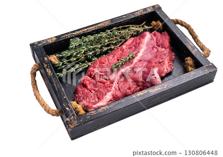 Uncooked hanging tender beef steak, Hanger steak in wooden tray with herbs isolated on white background. top view Uncooked hanging tender beef steak, Hanger steak in wooden tray with herbs isolated on white background. top view 130806448