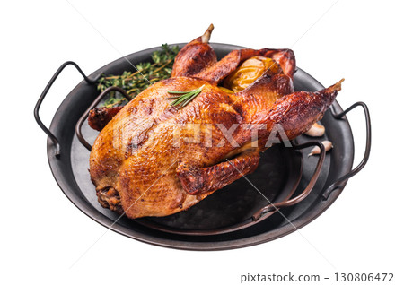 Roasted whole goose on steel tray isolated on white background. top view Roasted whole goose on steel tray isolated on white background. top view 130806472
