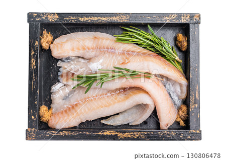 Ready for cooking Raw Hake fish fillets in a wooden tray with herbs isolated on white background. top view 130806478