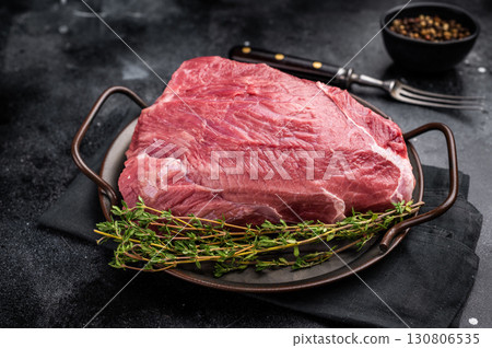 Raw Wild Boar meat, fresh Game Meat. black background. top view Raw Wild Boar meat, fresh Game Meat. black background. top view 130806535