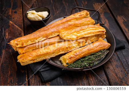 Homemade pastry, Bread sticks with cheese and salt. wooden background. top view 130806559