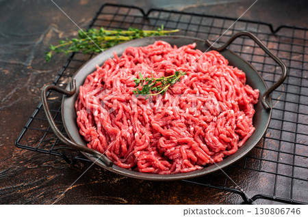 Fresh Raw pork and beef ground mince meat, mincemeat in a plate on brown background. 130806746