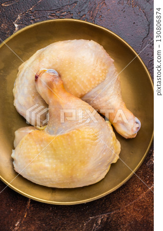 Chicken legs, raw poultry meat on black background, top view Chicken legs, raw poultry meat on black background, top view 130806874