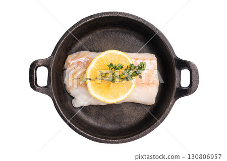 Raw cod fish fillets, whitefish without skin in skillet isolated on white background Raw cod fish fillets, whitefish without skin in skillet isolated on white background 130806957