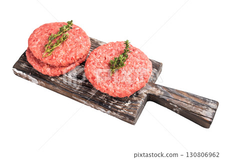 Raw pork and beef meat patties with herbs on wooden board isolated on white background Raw pork and beef meat patties with herbs on wooden board isolated on white background 130806962