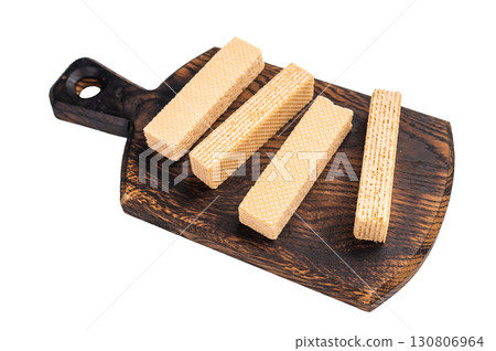 Wafer stick biscuits on wooden board isolated on white background. top view Wafer stick biscuits on wooden board isolated on white background. top view 130806964