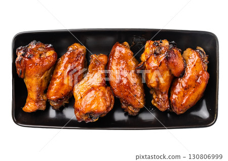 Juicy barbecue chicken wings, perfectly grilled and glazed, ideal for your next summer cookout or party. isolated on white background. top view 130806999