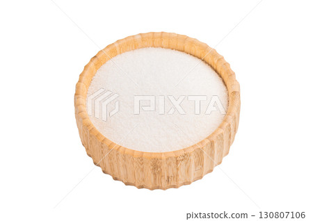 Versatile white sugar in a rustic bowl, ready to enhance desserts and beverages with its delightful sweetness. isolated on white background. top view Versatile white sugar in a rustic bowl, ready to enhance desserts and beverages with its delightful sweetness. isolated on white background. top view 130807106