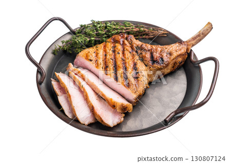 Flavorful grilled pork loin chop with bone, expertly cooked to perfection, making it the star of any meal. isolated on white background. top view Flavorful grilled pork loin chop with bone, expertly cooked to perfection, making it the star of any meal. isolated on white background. top view 130807124