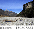Upper Rhine River: Stones and driftwood on the riverbed during the winter when there is little water (Canton of St. Gallen, Switzerland) 130807283